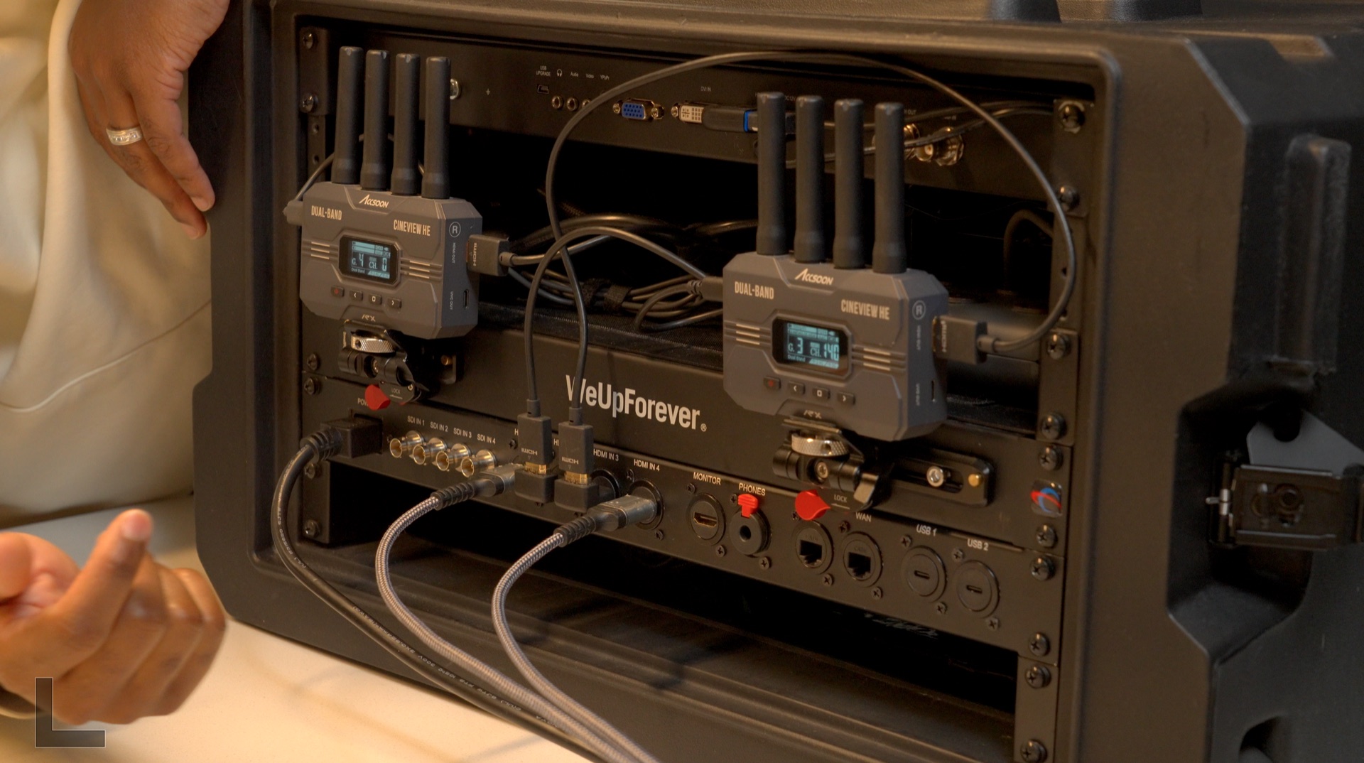 Winston's fly pack with two wireless receivers above a custom rack panel fitted with video, audio, network, and USB connections.