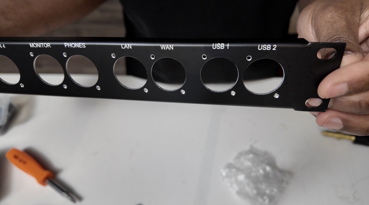 Monitor, headphones, LAN, WAN, and USB cutouts on the right side of the custom panel.